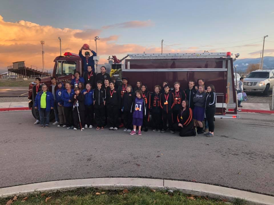 Special Olympic Athletes posing with fire truck